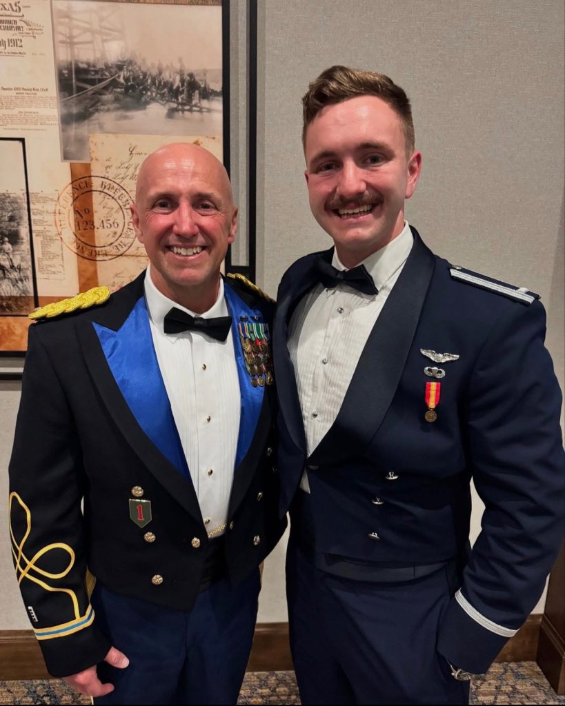 Scott Pool with his son Nathan at Nathan's flight school graduation